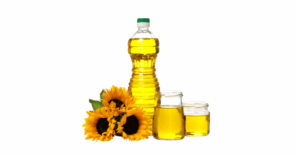 Bottle of sunflower oil with a fresh sunflower on a kitchen counter