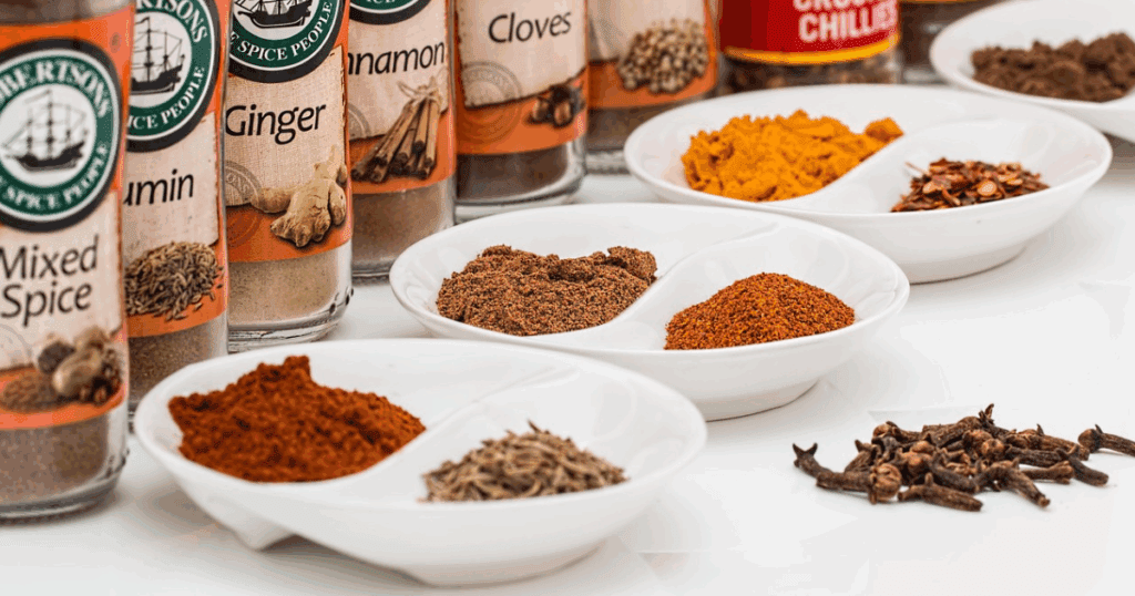 Traditional Emirati spice mix with cumin, turmeric, cardamom, and cinnamon in bowls