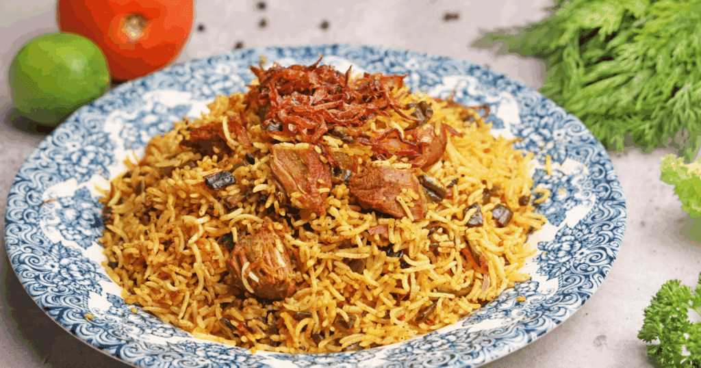 A steaming pot of biryani with long, fluffy basmati rice grains served in a Dubai kitchen